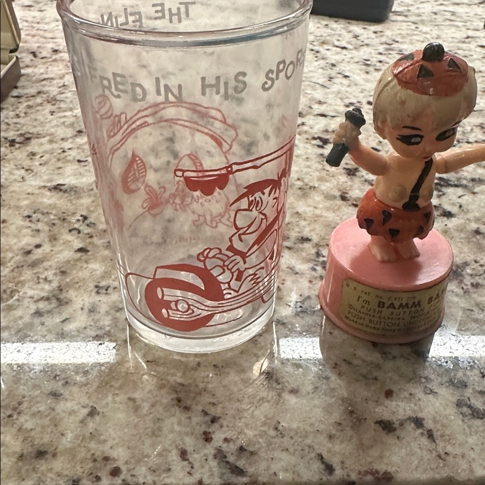 Bamm Bamm push button puppet from 1960s and jelly glass with Flintstones on it